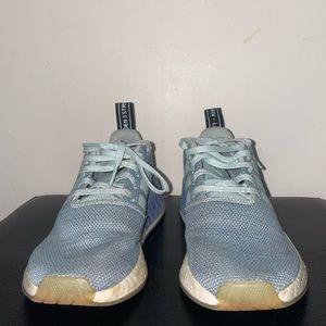 Blue multi-toned NMD Adidas sneakers.